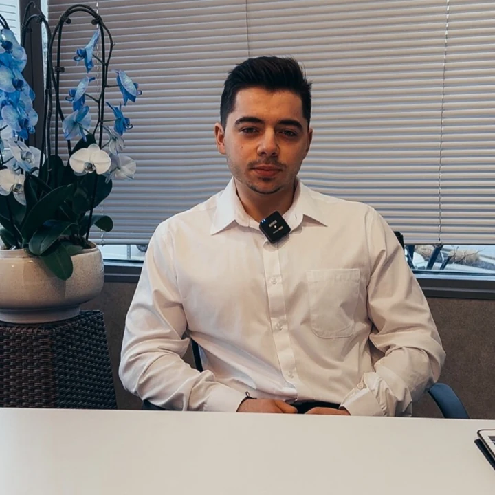 Gabriel Macovei seated in a professional office